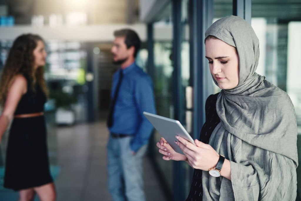 Shot of a young businesswoman using a digital tablet in a modern office